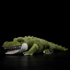 Realistic alligator plush toy lying on its side, showcasing lifelike details and soft green texture