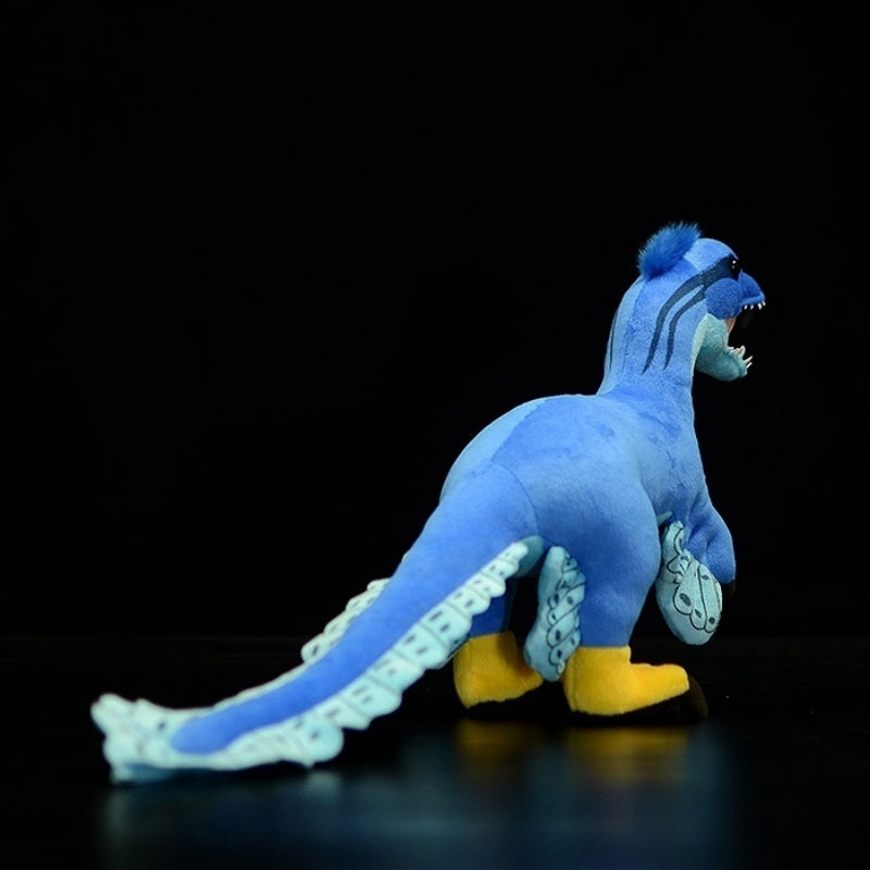 Rear view of Microraptor dinosaur plush toy highlighting its long tail and intricate Cretaceous details