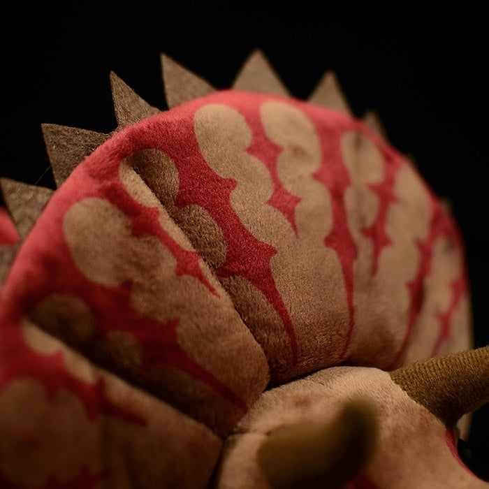 Frill details of Triceratops stuffed animal, featuring red-colored accents and soft texture