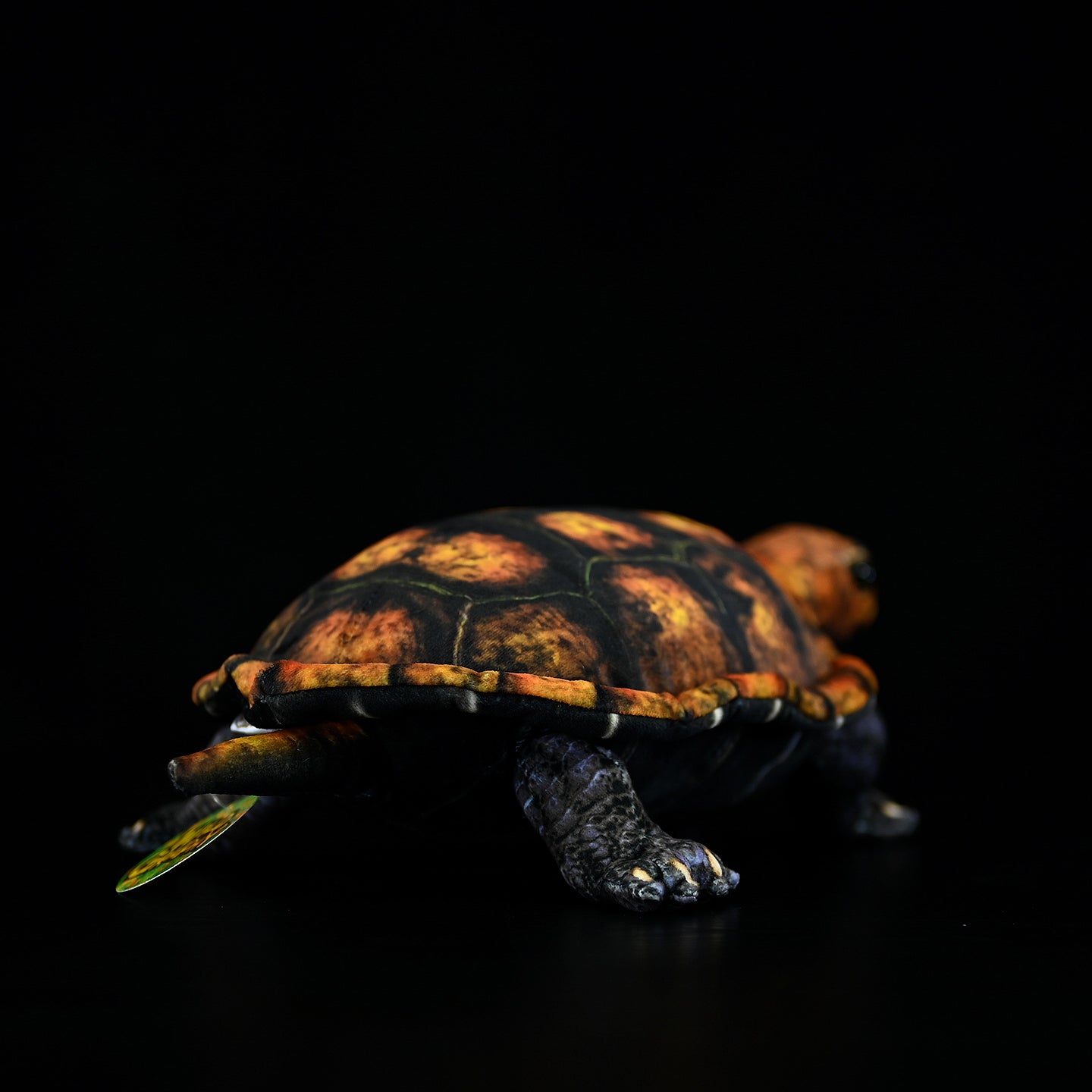 Rear view of a Japanese pond turtle plush, highlighting its realistic shell texture and intricate craftsmanship