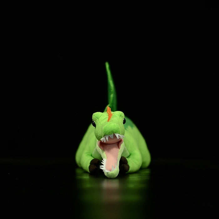Front view of Spinosaurus dinosaur plush showing sharp teeth and vibrant Jurassic details