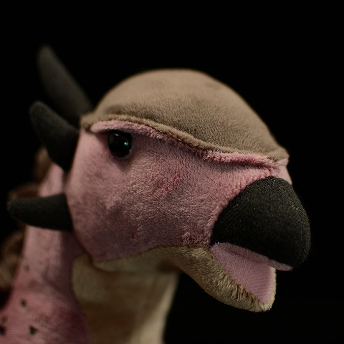 Close-up of the Pachycephalosaurus plush head by SoftDaysLab®, highlighting the domed skull and soft fabric