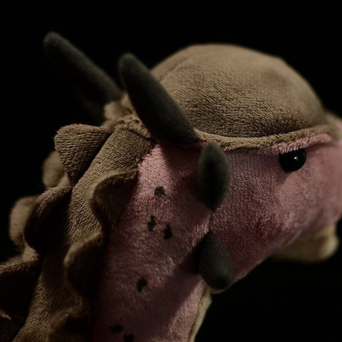 Detailed side perspective of the SoftDaysLab® Pachycephalosaurus Plush Toy, showing horn and neck accents