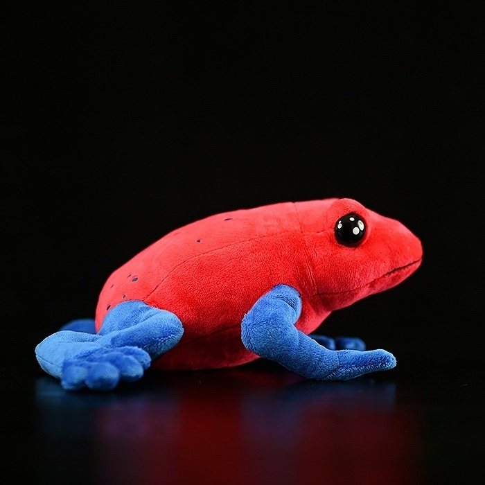 Side view of Strawberry Poison Dart Frog plush, highlighting lifelike details and vivid red-blue tones