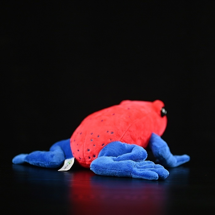 Back view of Strawberry Poison Dart Frog plush toy with spotted red body and soft blue legs