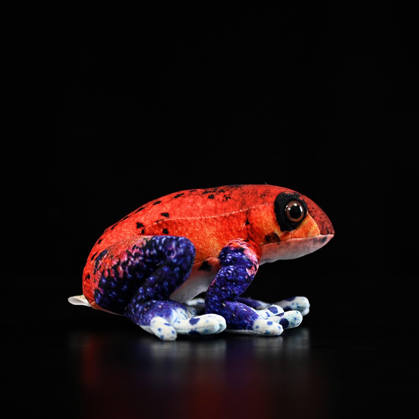 Side profile of the colorful Blue Jeans Morph Strawberry Poison Dart Frog Plush with intricate details