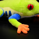 Close-up of Red-Eyed Tree Frog plush's orange hand and soft fabric texture for nature enthusiasts