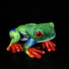 Lifelike red-eyed tree frog plush by SoftDaysLab, featuring vibrant green, blue, and orange details
