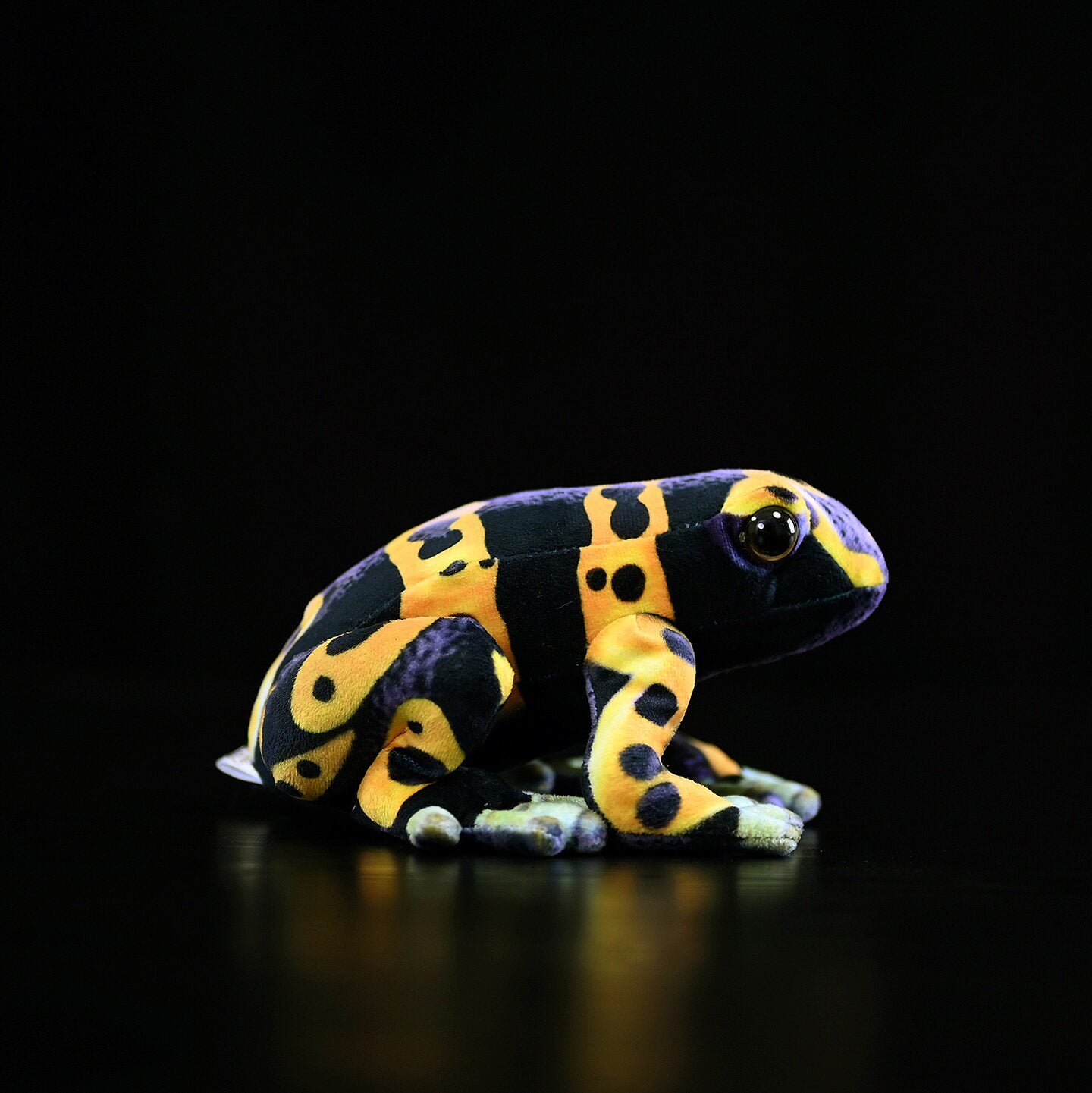 Profile view of a Yellow-Banded Poison Dart Frog Plush featuring detailed craftsmanship and bold colors