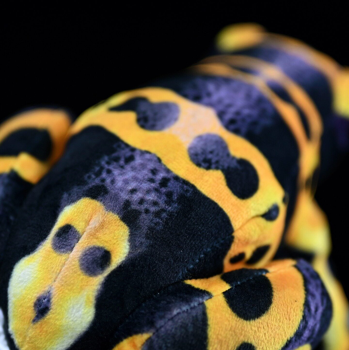 Back close-up of Yellow-Banded Poison Dart Frog Plush showcasing fine yellow-and-black markings