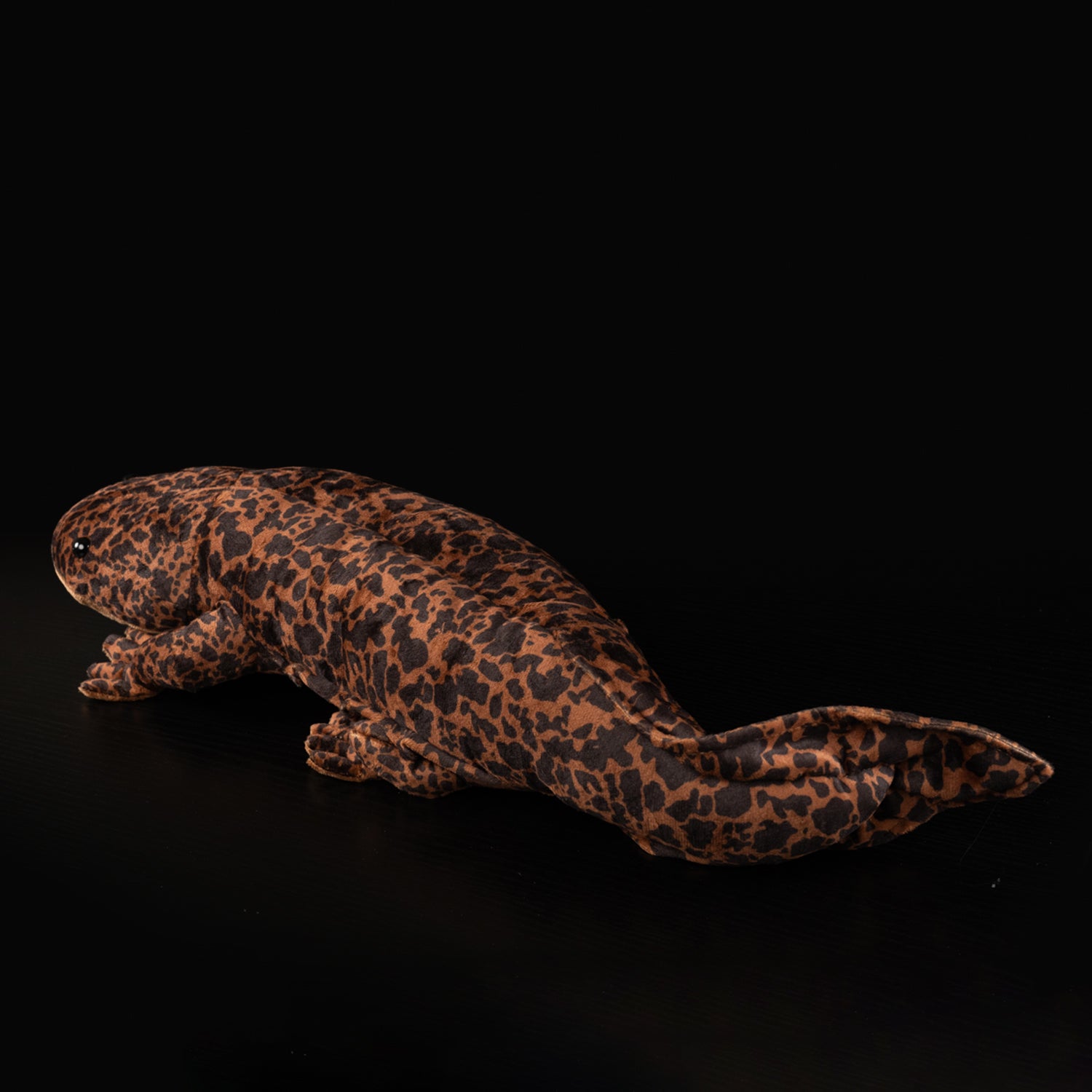 Rear view of the Chinese giant salamander plush, featuring its detailed tail and leopard-like patterns