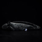 Side view of Black Melanoid Axolotl Plush Toy by SoftDaysLab, showcasing sleek and lifelike features