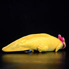 Side profile of the Golden Albino Axolotl plush, showcasing its lifelike details and soft texture