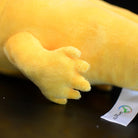 A close-up of the plush axolotl’s realistic golden paw, showcasing its high-quality craftsmanship
