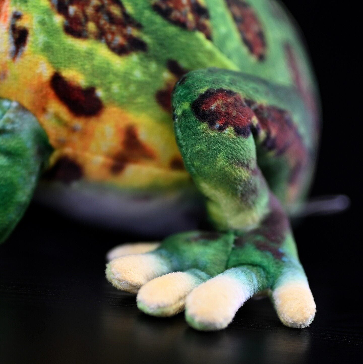 Close-up of lifelike frog plush feet highlighting intricate design and naturalistic textures for collectors and kids