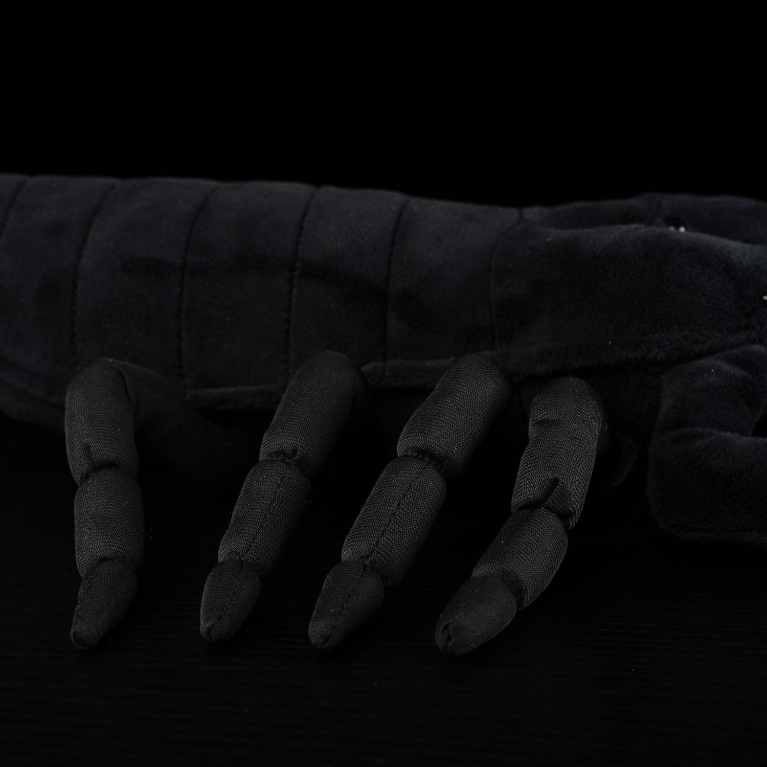 Detailed view of the Emperor Scorpion Plush Toy’s lifelike black legs and textured body by SoftDaysLab