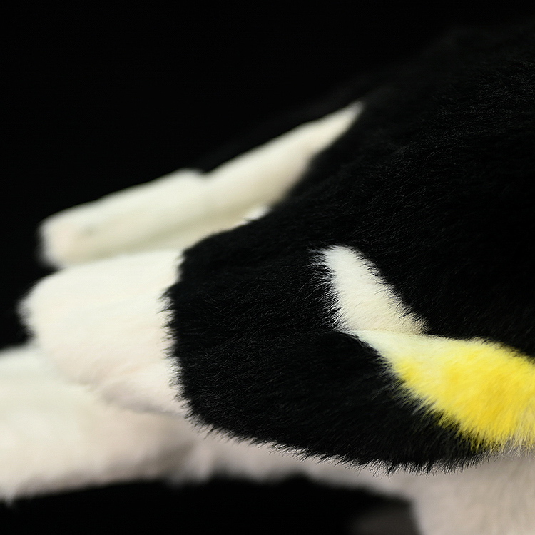 Close-up of the Great Hornbill plush toy’s soft black and yellow feathers, showcasing fine craftsmanship