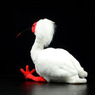 Backside view of fluffy Asian crested ibis stuffed animal with realistic red and white accents by SoftDaysLab