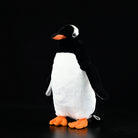 Realistic Gentoo Penguin plush toy by SoftDaysLab, full view, black and white design with orange beak and feet