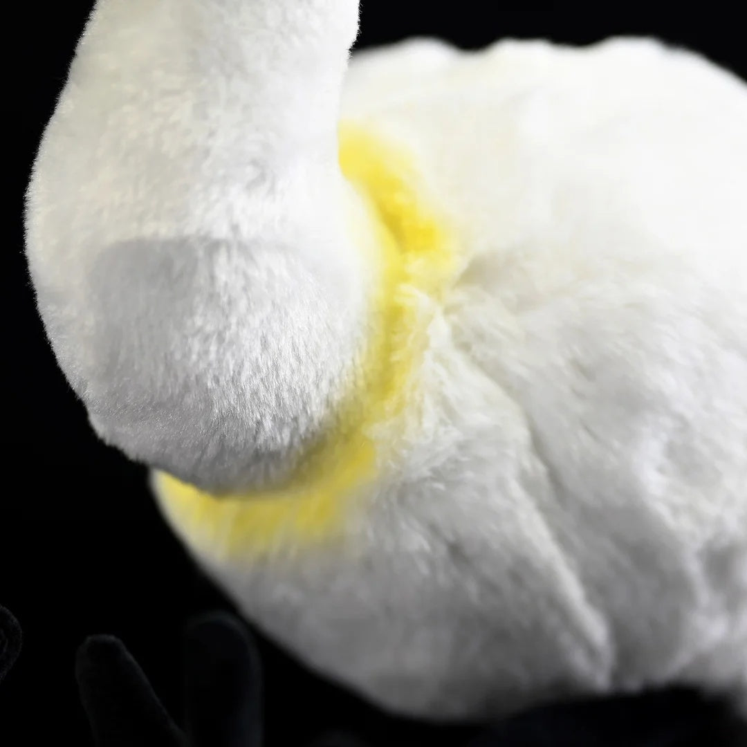 Detailed shot of the Black-faced Spoonbill Plush Toy's golden chest feathers and soft texture