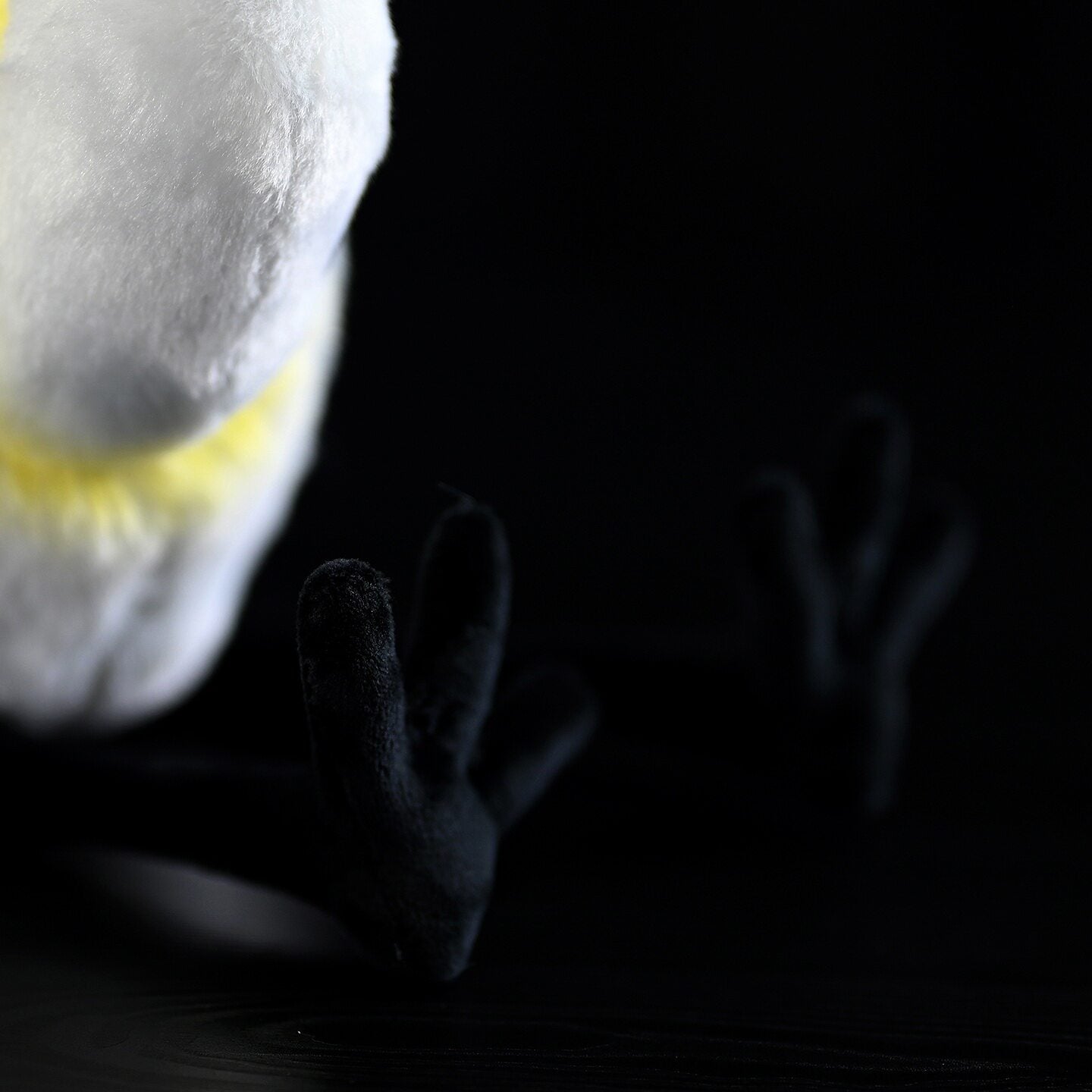 Close-up of the plush feet of the Black-faced Spoonbill Toy, crafted for realism and added charm