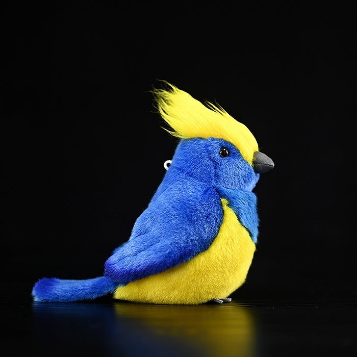 Side view of Sultan Tit Plush Toy, highlighting its vibrant yellow crest and soft blue feathers