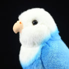Close-up of the Blue Lovebird plush toy’s face, showcasing its soft beak and lifelike details