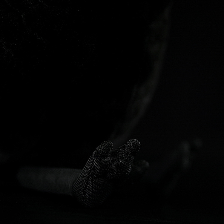 Detailed view of American crow plush toy’s feet, showcasing realistic design and intricate craftsmanship