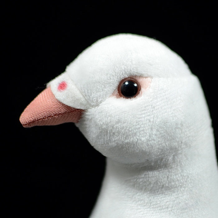 Side close-up of White Dove Plush Toy's beak and eye, highlighting its soft and realistic design by SoftDaysLab