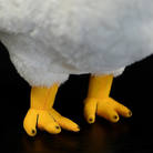 Close-up of White Rooster Chicken Plush Toy’s yellow feet, highlighting their realistic structure and stitching