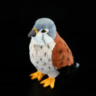 Angled view of Eurasian Kestrel Plush Toy, featuring its realistic beak and soft, huggable texture