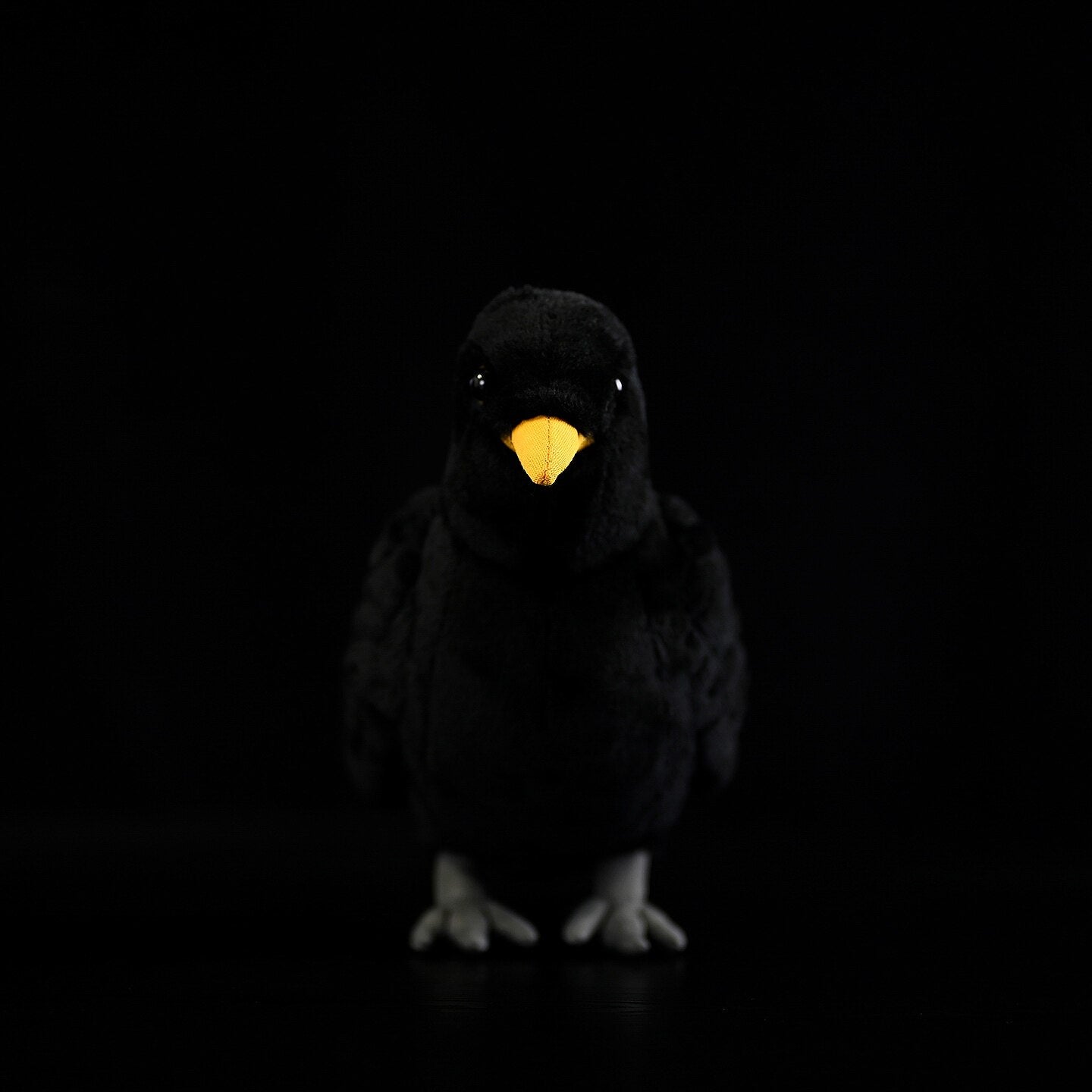 Eurasian Blackbird plush toy featuring a soft black body, bright yellow beak, and lifelike design
