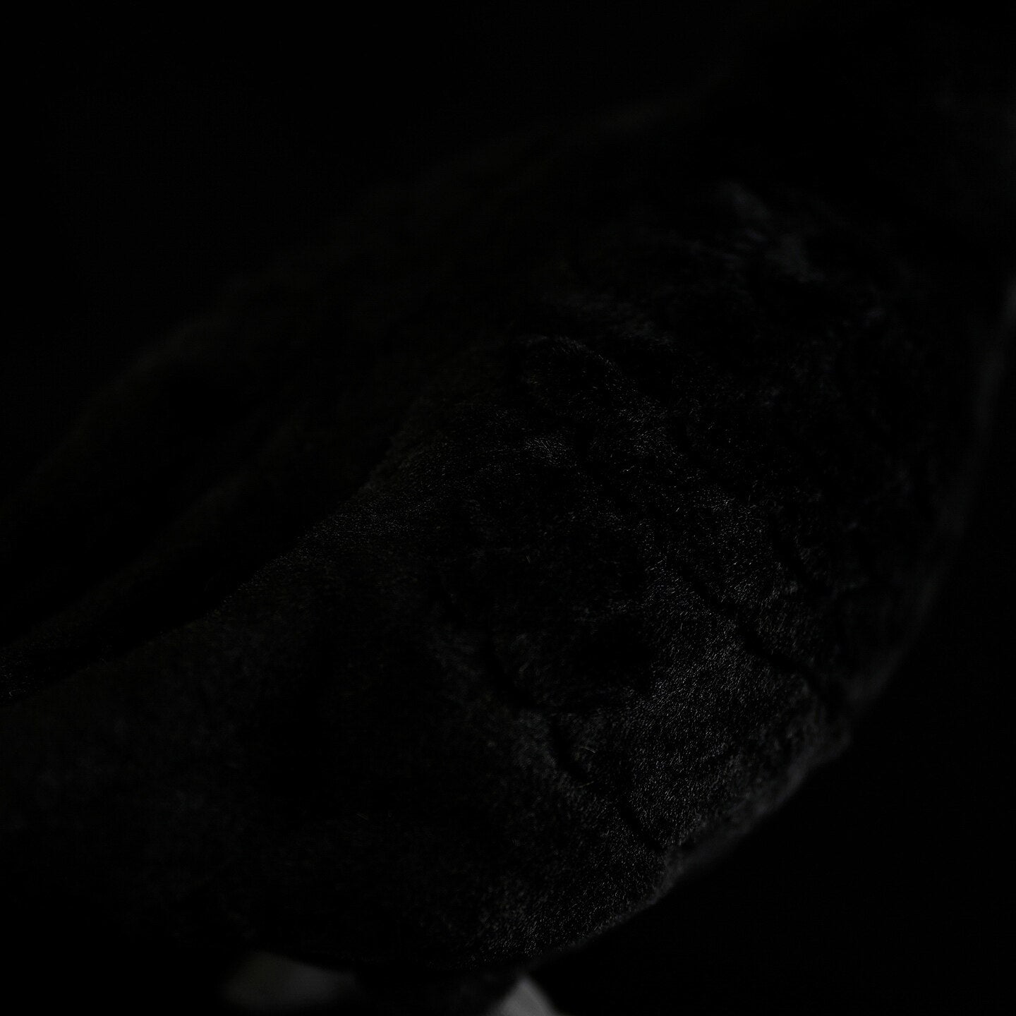 Soft and detailed black fur on the body of the Eurasian Blackbird plush toy