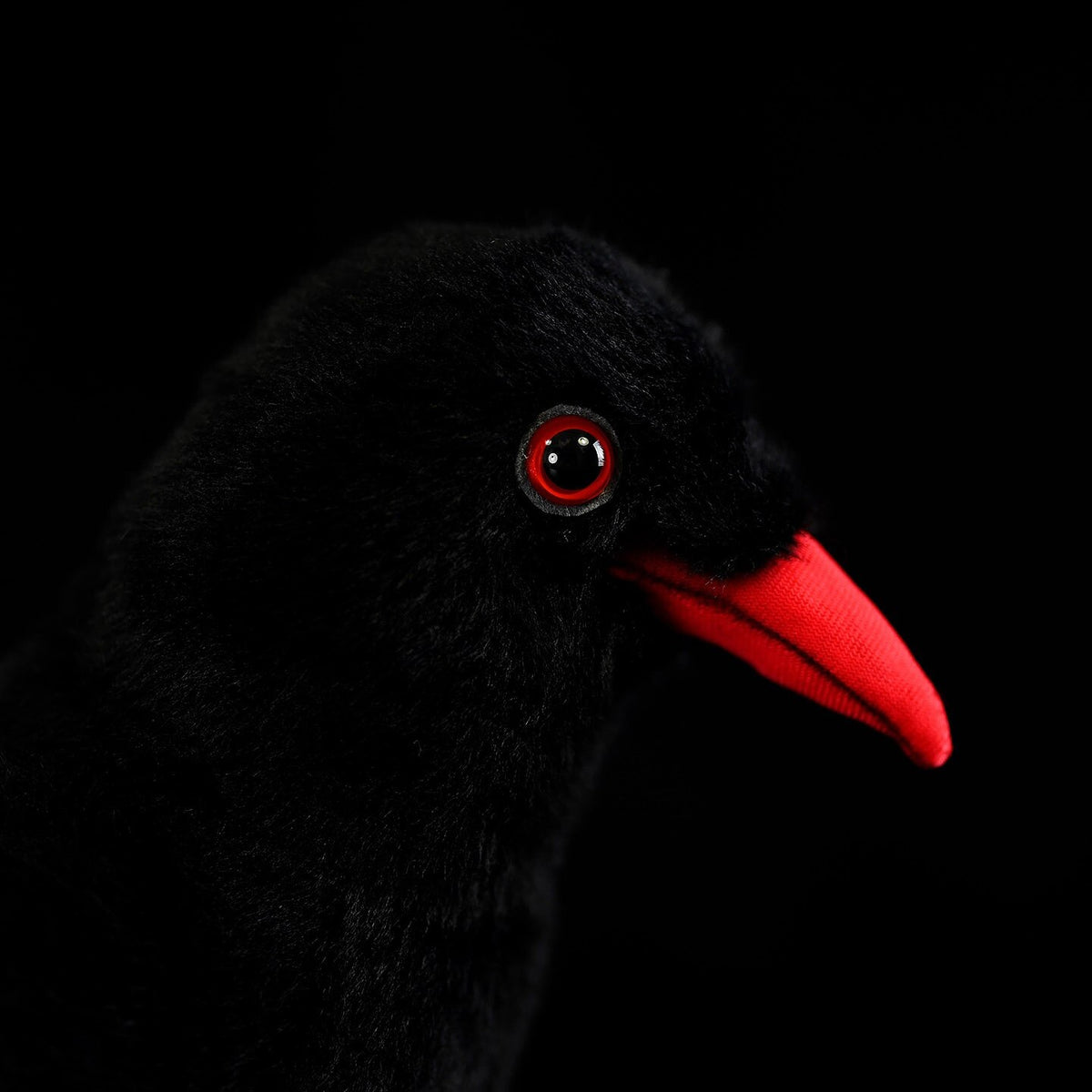 Rear view of Red-Billed Chough bird plush toy with detailed black feathers and vibrant red legs and beak