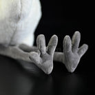 Close-up of Chinese Egret bird plush toy's soft gray feet with detailed design and lifelike texture