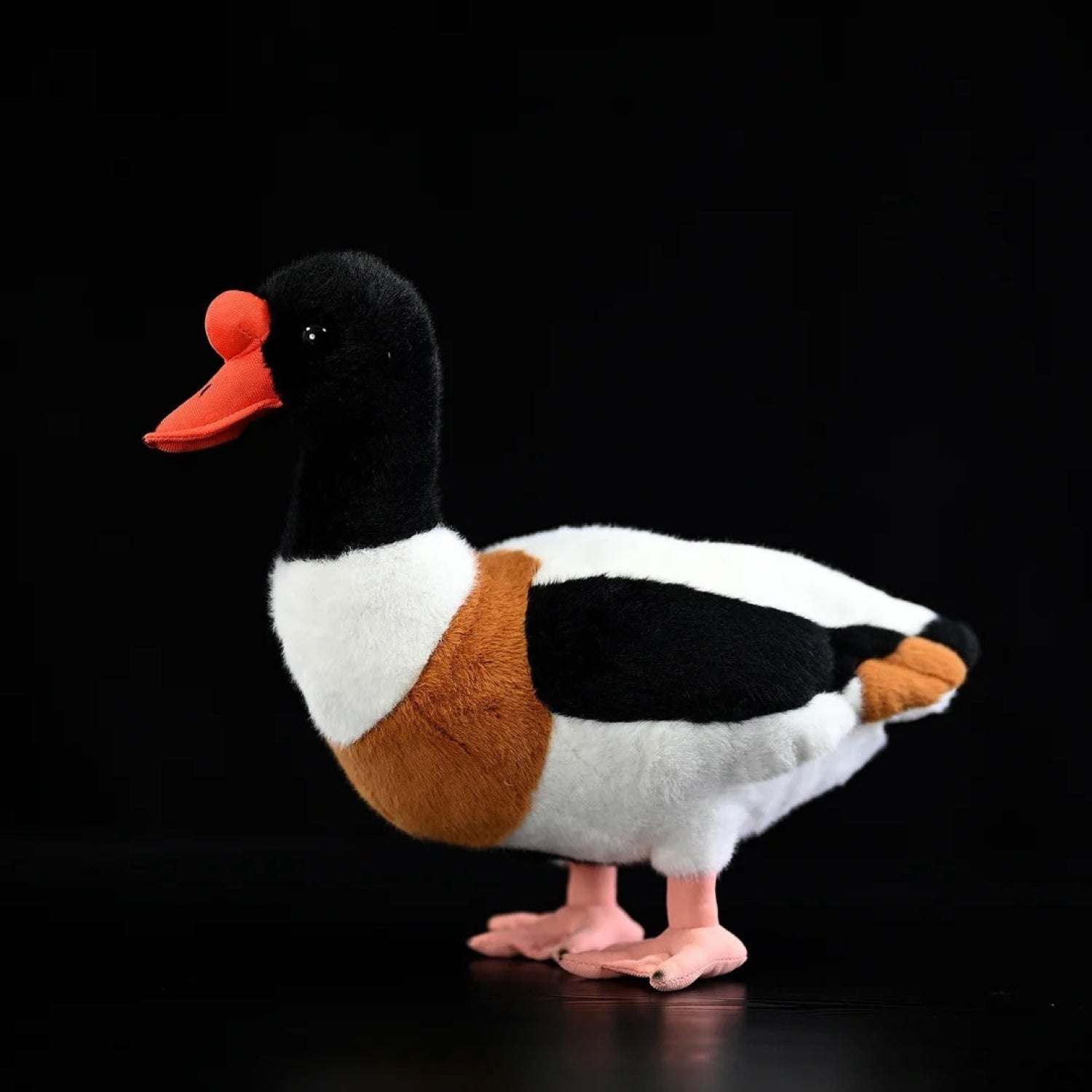 Realistic common shelduck plush toy with black, white, and orange details, perfect for bird enthusiasts
