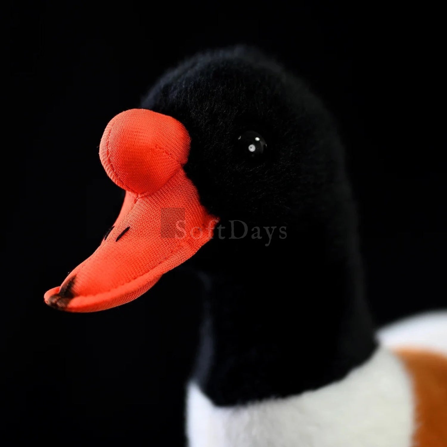 Close-up of common shelduck plush toy’s orange beak and black head, perfect for bird-themed collections
