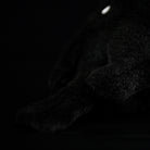 Close-up of the carrion crow plush toy’s tail, emphasizing its high-quality craftsmanship