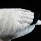 Close-up of the wings on a Bar-headed Goose plush toy, highlighting soft fabric and realistic texture
