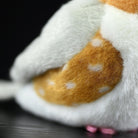 Close-up of Zebra Finch Plush Toy's spotted body, highlighting soft, realistic textures