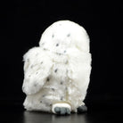 Back view of a snowy owl plush toy, showcasing its soft fur and spotted patterns, inspired by real snowy owls