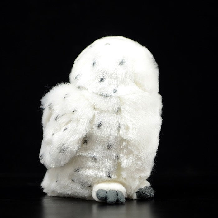Back view of a snowy owl plush toy, showcasing its soft fur and spotted patterns, inspired by real snowy owls