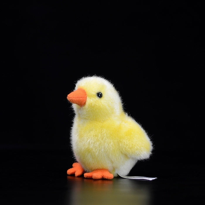 Lifelike yellow chick plush toy with soft fur and an orange beak, perfect for animal lovers