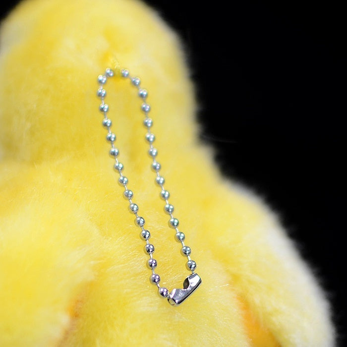 Detail of the durable metal chain on the yellow chick plush toy, perfect for hanging as a keychain or decor