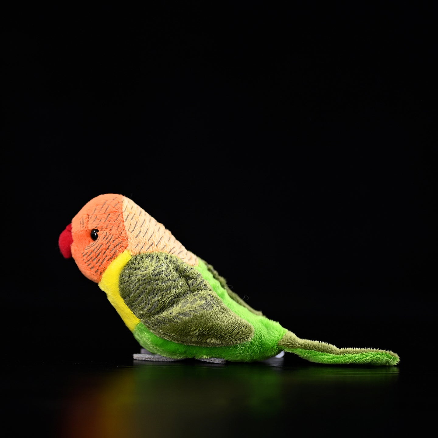 Realistic side profile of a Lilian's lovebird plush, showcasing soft textures and vibrant colors