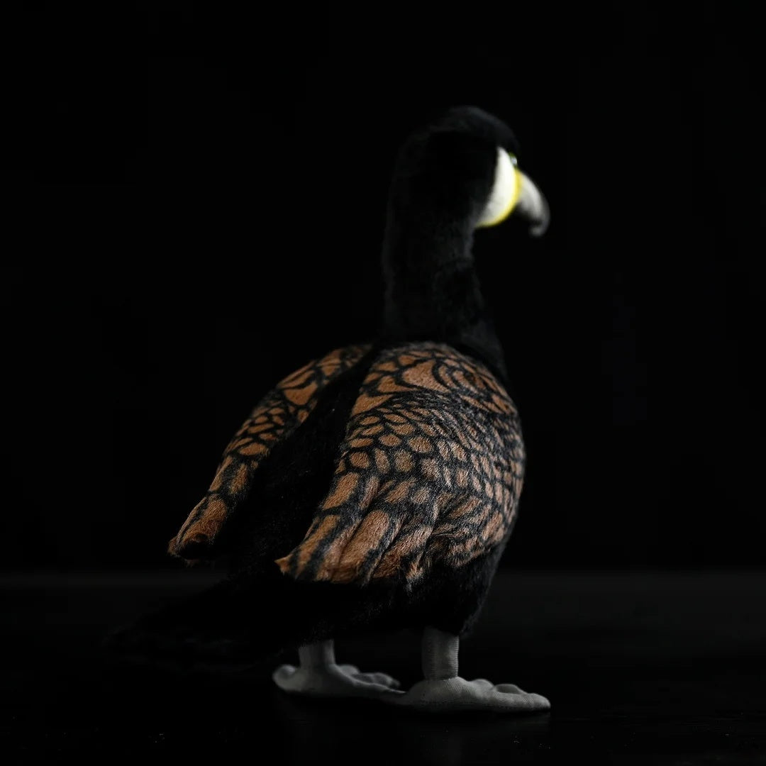 Rear-left view of a Great Cormorant plush toy, highlighting detailed feathers and realistic tail design