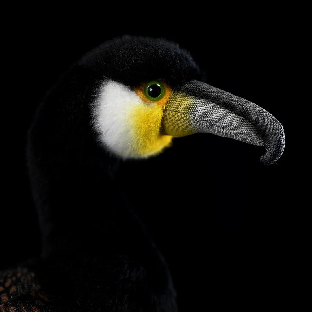 Close-up of a Great Cormorant plush toy’s face, showing realistic beak and striking green eyes by SoftDaysLab