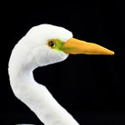 Close-up of the Great White Egret plush toy's head, showing its lifelike yellow bill and green accents