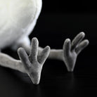 Detailed view of the Great White Egret plush toy's soft gray feet, adding to its lifelike design