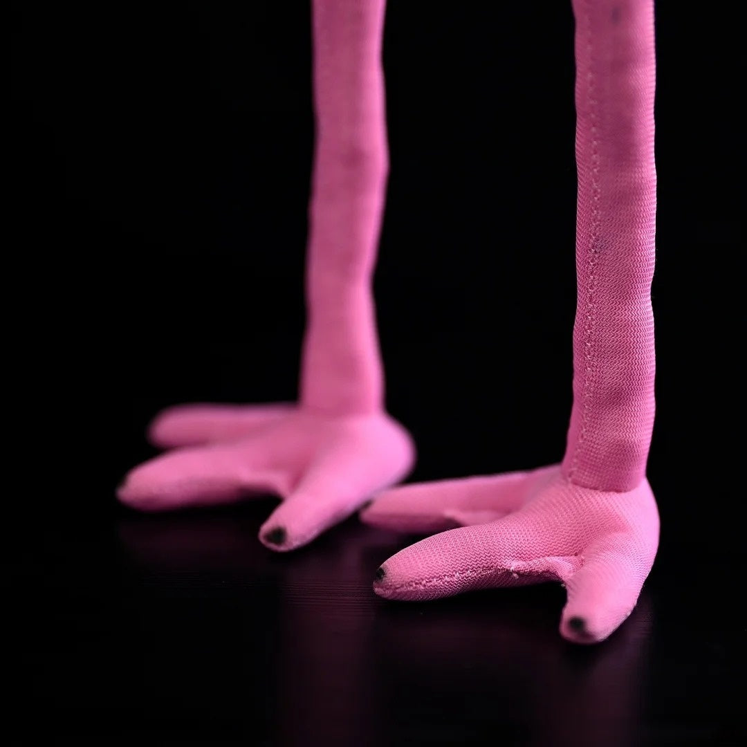 Pink legs of the Black-winged Stilt plush toy, showcasing its lifelike design and fine stitching